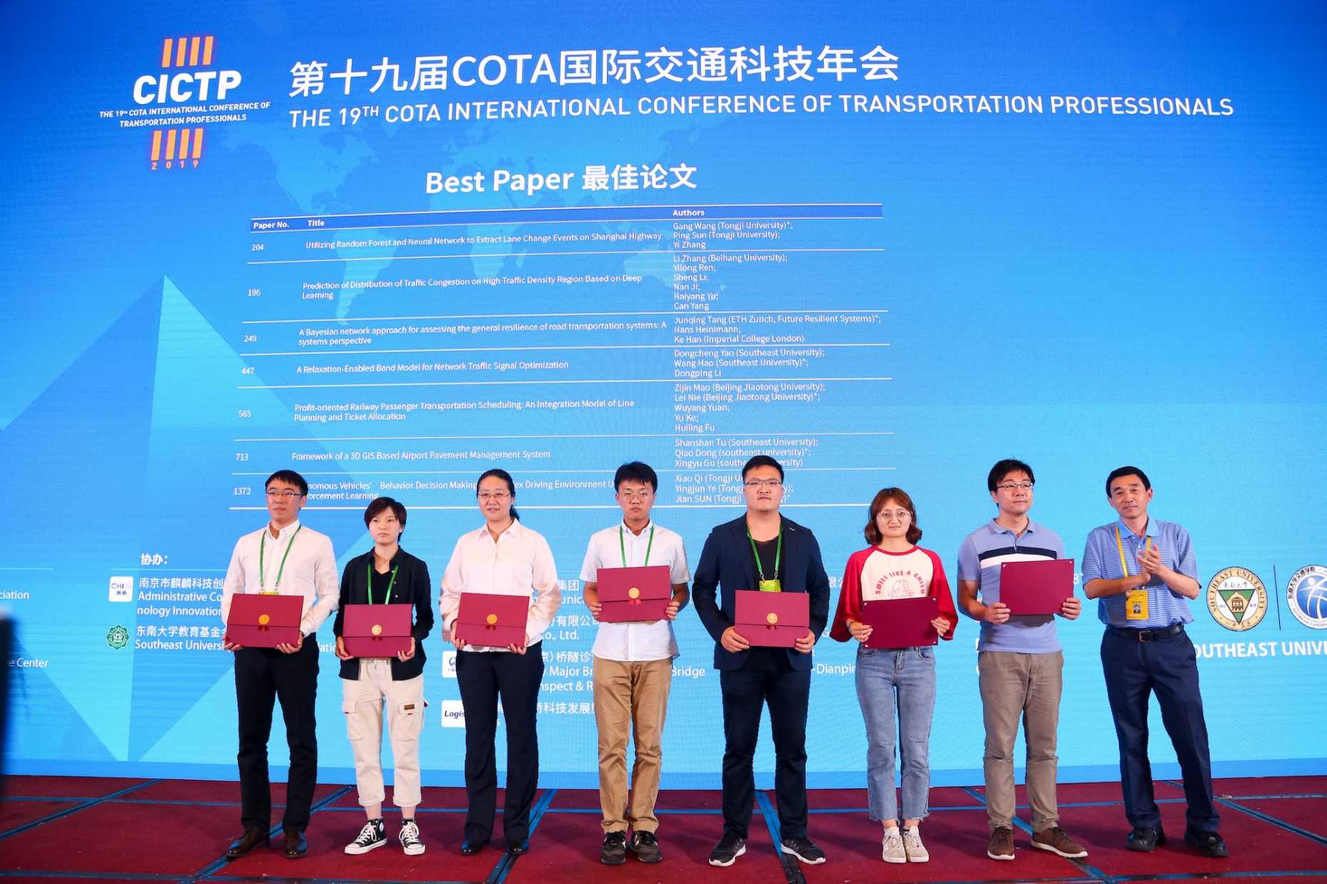 Tang Junqing (4th from right) won best paper award at the CICTP 2019.